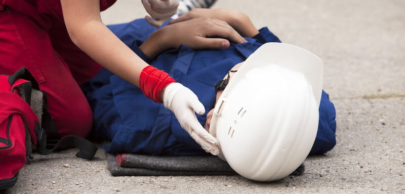 Paramedic attends to injured worker