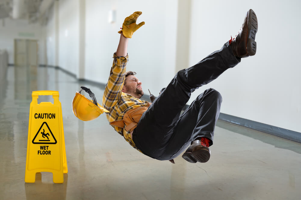 Worker falling on wet floor inside the building