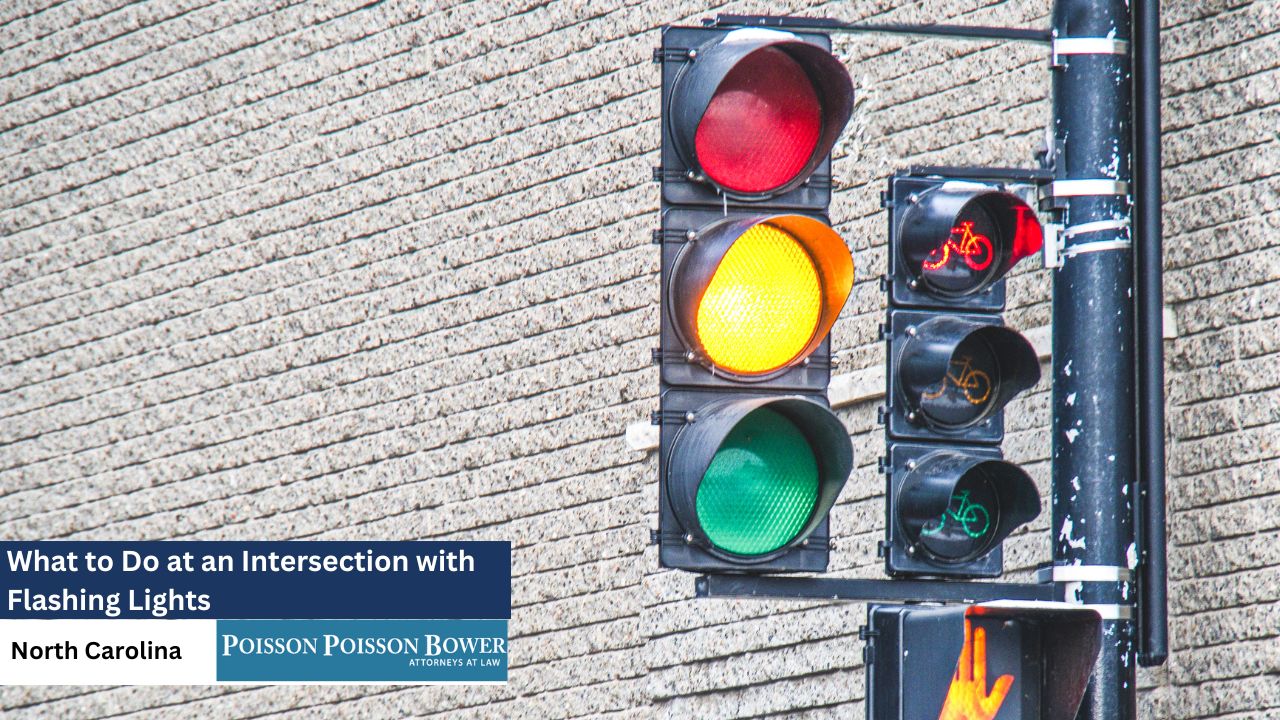 A close-up shot shows a traffic signal with a red, yellow, and green light illuminated against a textured brick wall, with a pedestrian signal partially visible below and legal information overlaid on the image.