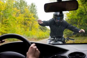 collision between motorcycle and car