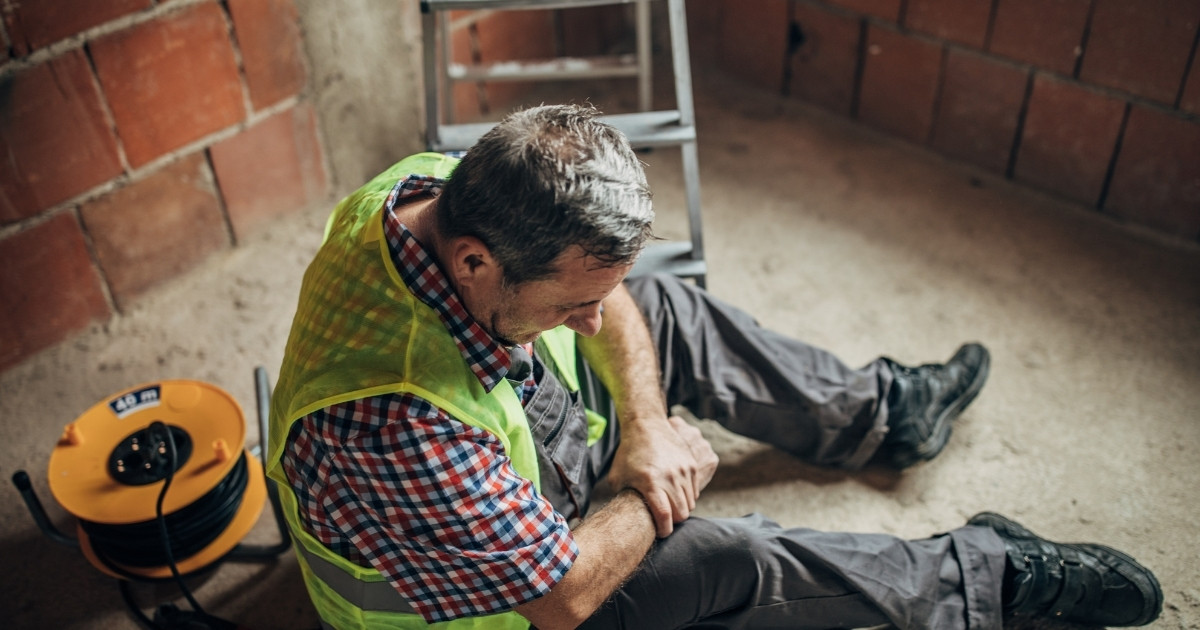 Injured worker on construction site.