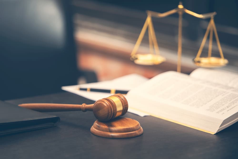 Judge Gavel with Law Book on Wooden Table